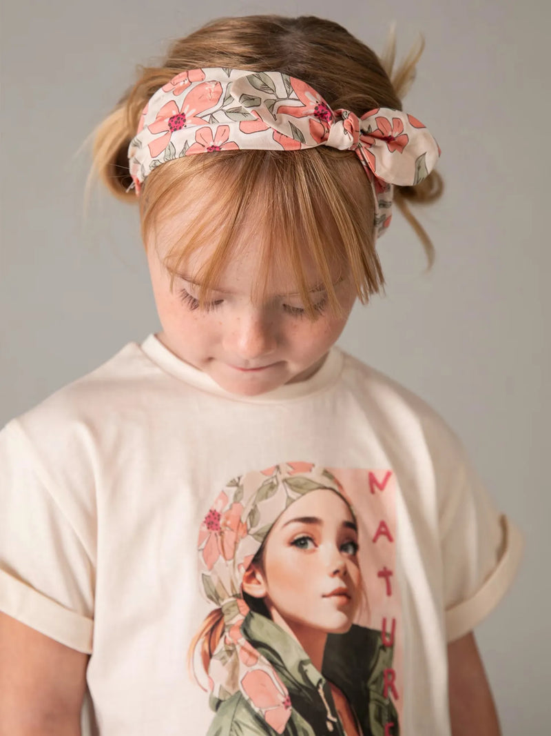 Girl wearing the Mayoral floral print shorts set.