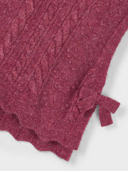 Girl's knitted vest with scalloped hem.