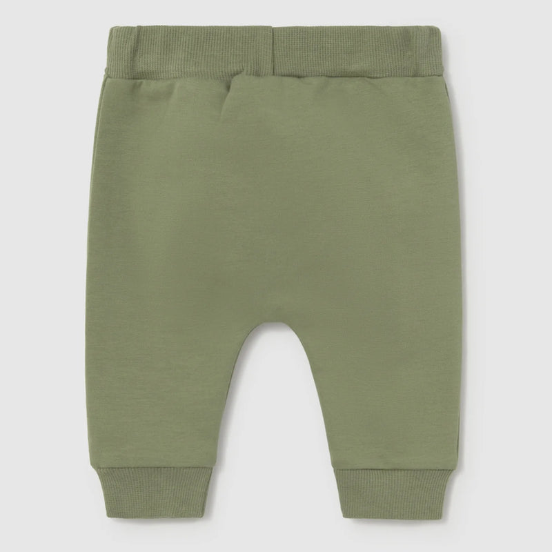 Baby boy's green track bottoms.