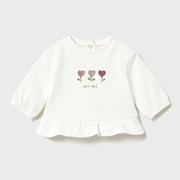 Baby girl's white t-shirt with embroidered flowers on the front.