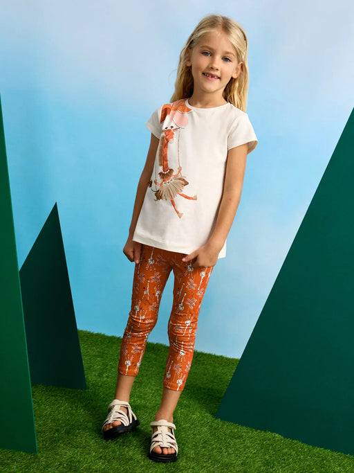 Girl wearing the Mayoral giraffe leggings set.