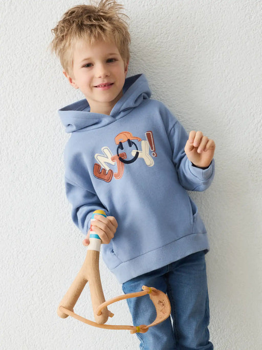 Boy modelling the Mayoral hoodie.
