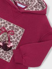 Closer look at the Mayoral hoodie dress showing detail of the sequin cherry design on the front.