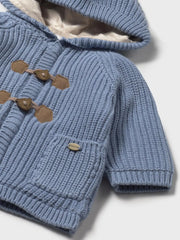 Closer look at the Mayoral rib knit jacket showing detail of the teddy bear toggles