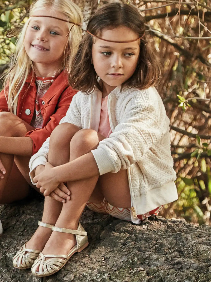 Girl modelling the Mayoral knitted jacket.