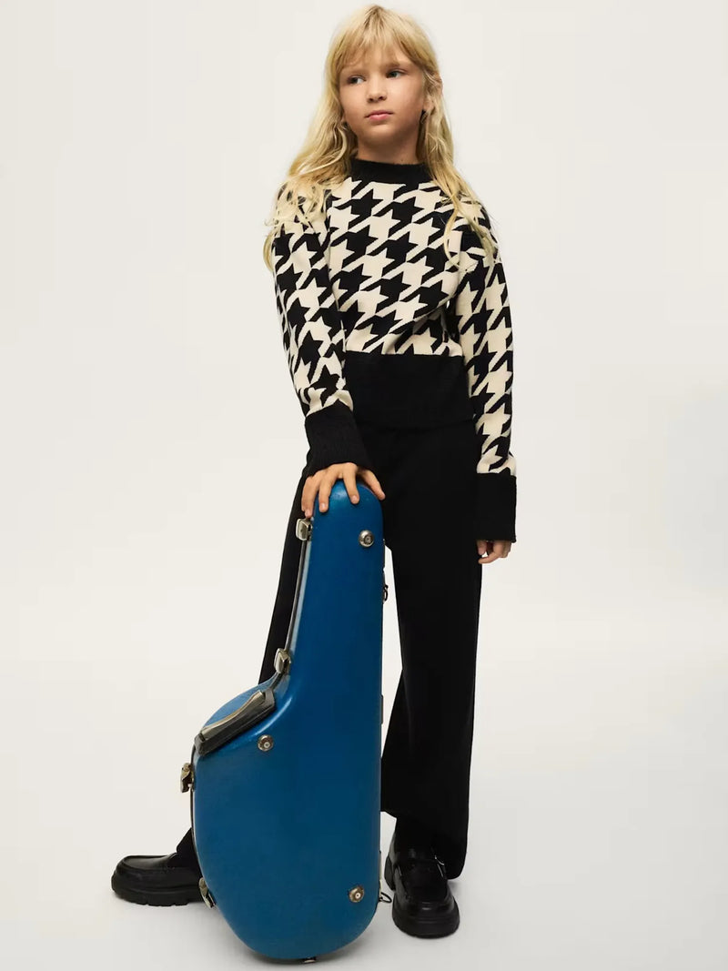 Girl modelling the Mayoral houndstooth jumper set.