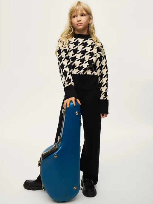 Girl modelling the Mayoral houndstooth jumper set.