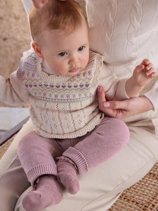Baby girl modelling the Mayoral knitted set.