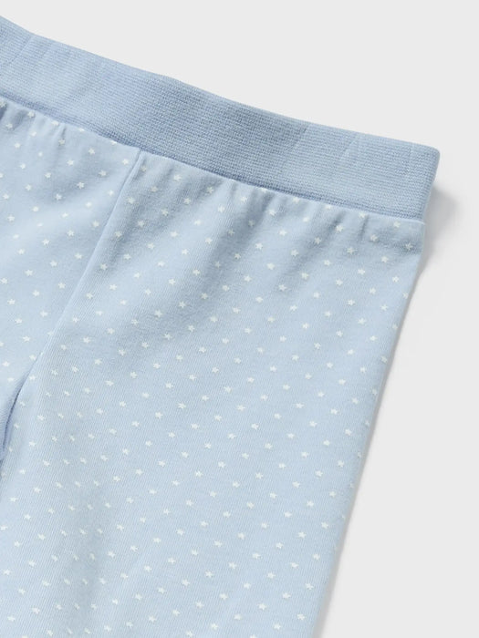 Pale blue leggings with white spot pattern. 