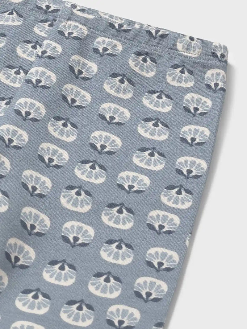 Closer view of the baby girl's floral print leggings.