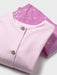 Closer look at the pale pink button up top.