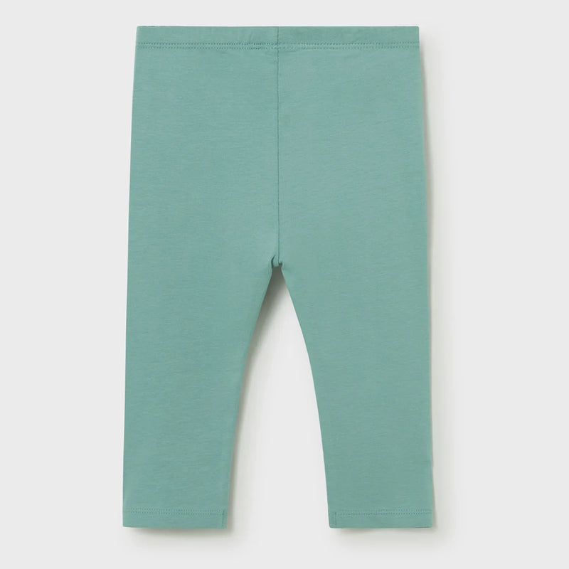 Girl's full length green leggings.