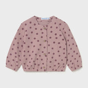 Baby girl's pink polka dot cardigan.