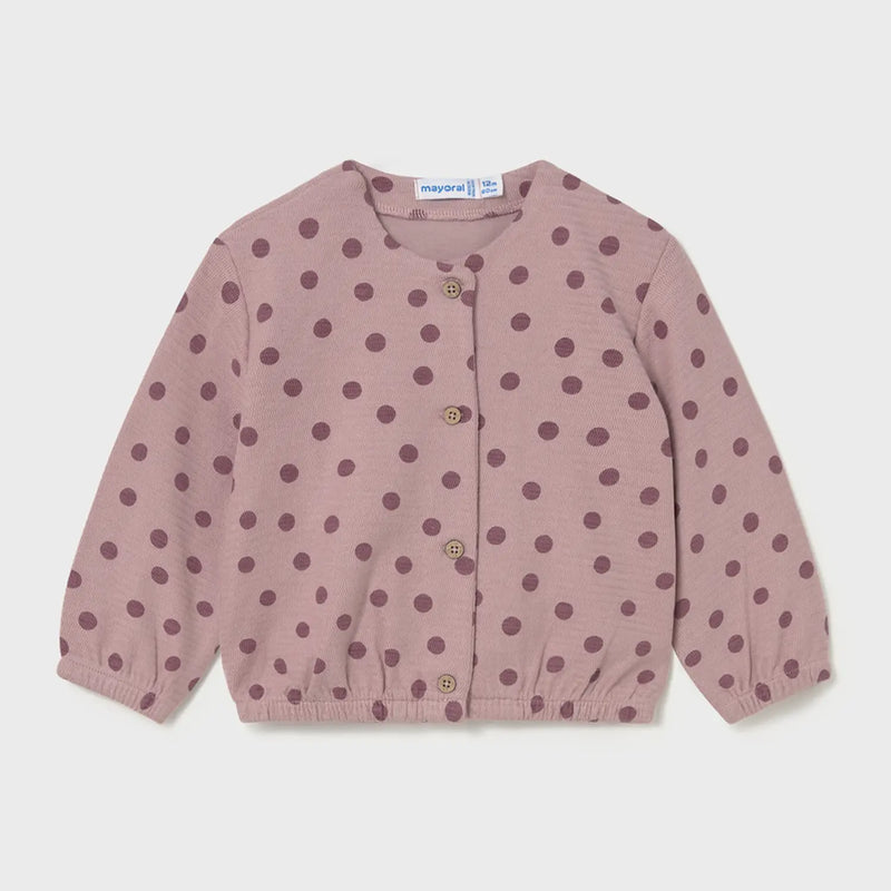 Baby girl's pink polka dot cardigan.