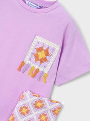 Closer look at the Mayoral leggings set showing detail of the colourful tassels.