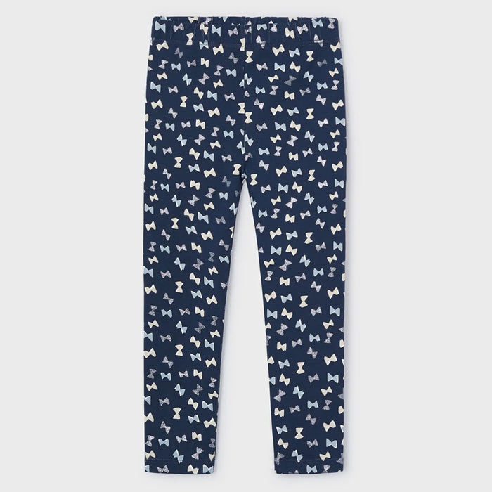 Navy leggings with blue and white bow pattern.