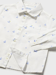 Closer look at the Mayoral sailboat shirt showing detail of the pattern of little blue sailboats.