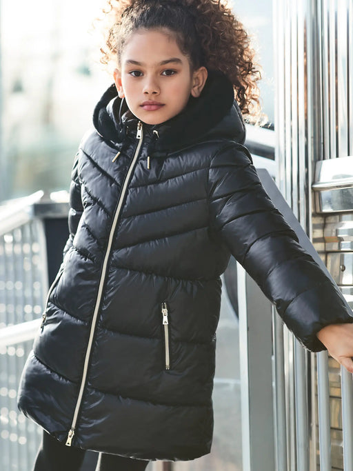 Girl modelling the Mayoral long coat.