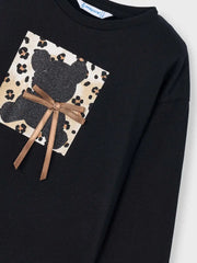 Girl's black t-shirt with glitter teddy bear design.