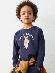 Boy in navy long sleeve t-shirt by Mayoral.