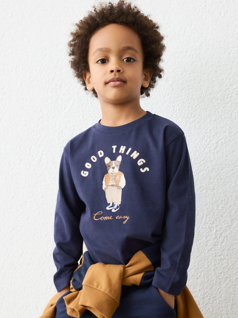 Boy in navy long sleeve t-shirt by Mayoral.