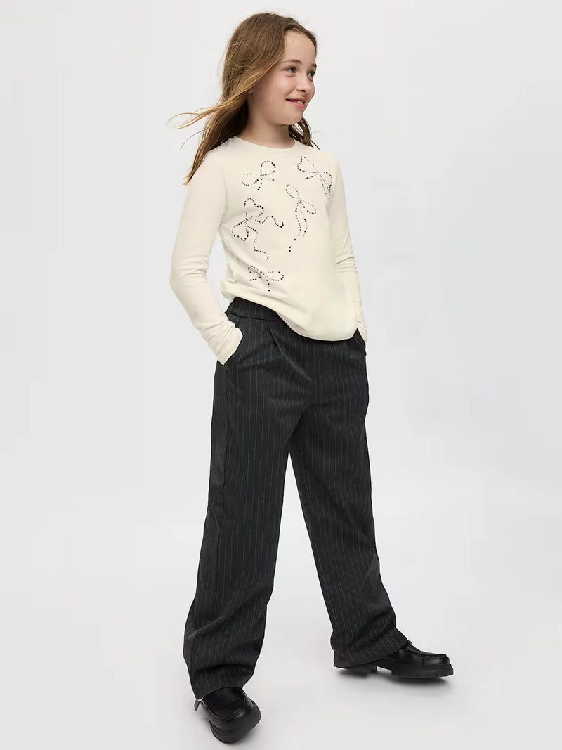Smiling Girl modelling the Mayoral long sleeve t-shirt.