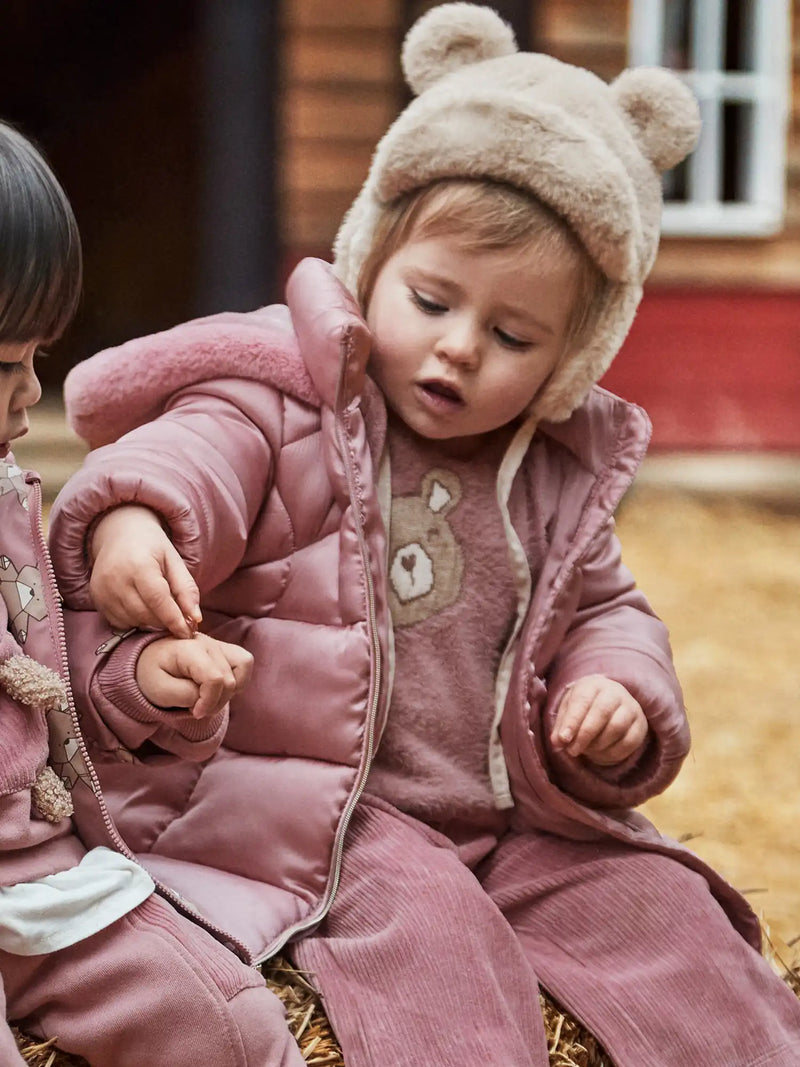 Baby girl wearing the Mayoral padded coat.