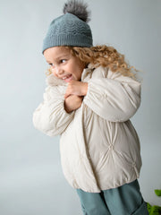 Girl wearing the Mayoral padded jacket.