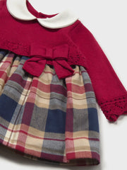 Closer look at the Mayoral plaid dress showing detail of the openwork detailing.