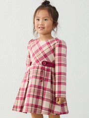 Girl modelling the Mayoral plaid dress.