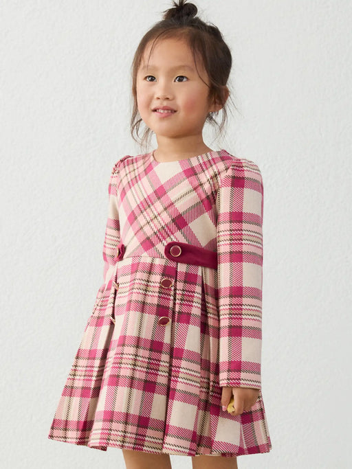 Girl modelling the Mayoral plaid dress.
