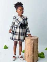 Girl wearing the Mayoral plaid dress.