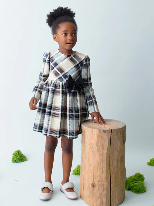Girl wearing the Mayoral plaid dress.