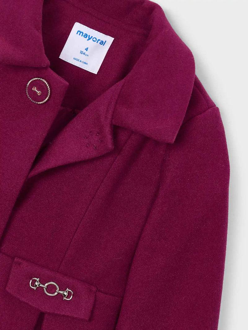 Closer view of the Mayoral pleated coat.