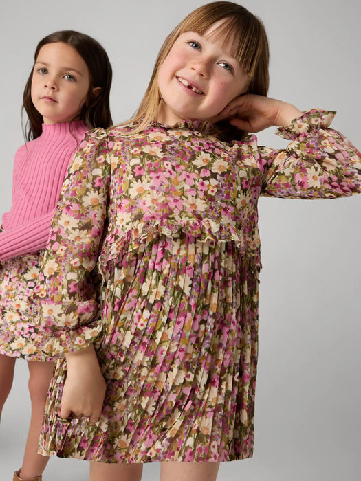 Girl modelling the Mayoral pleated dress.