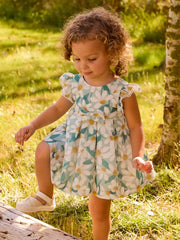 Baby girl modelling the Mayoral printed dress.