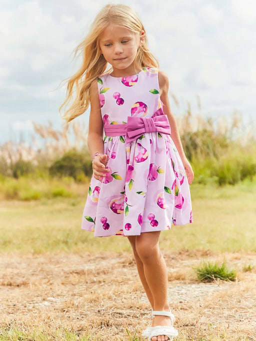 Girl modelling the Mayoral printed dress.