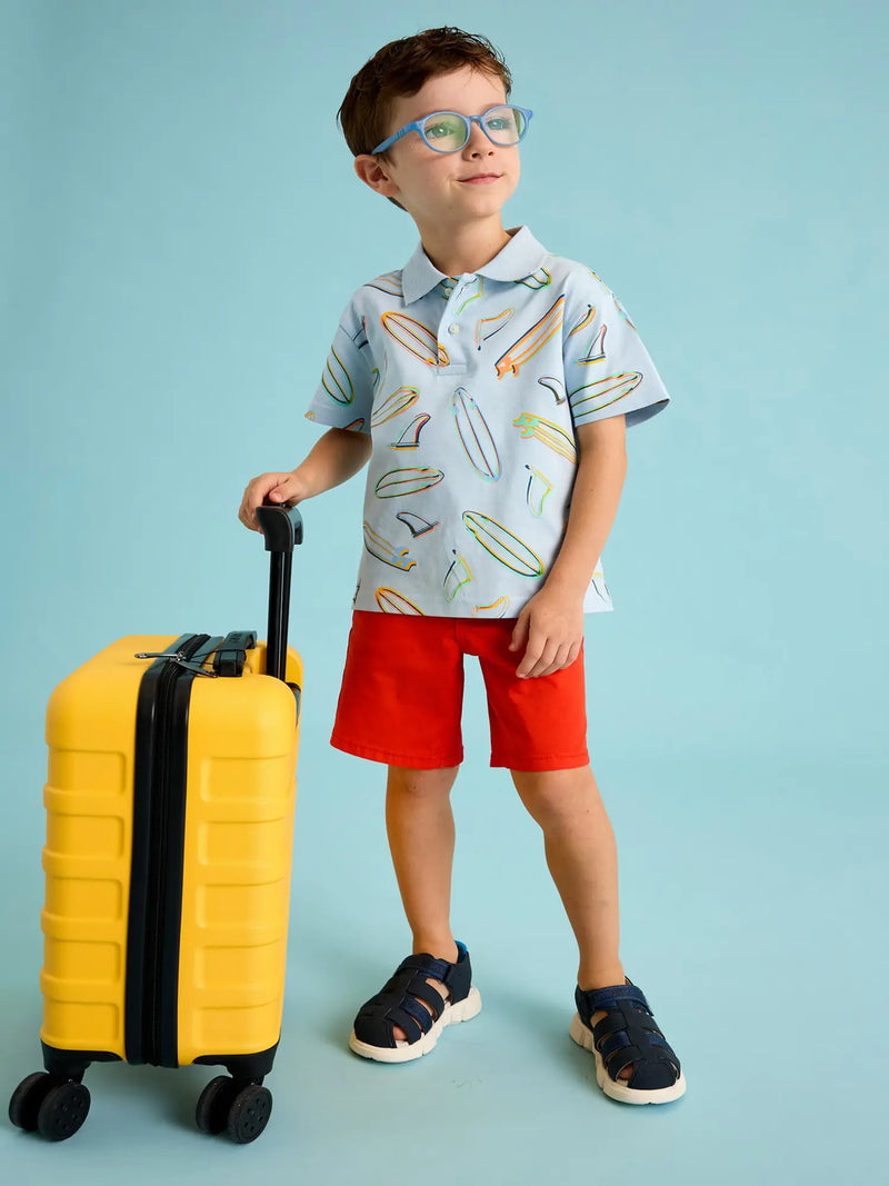 Boy modelling the Mayoral printed polo shirt.