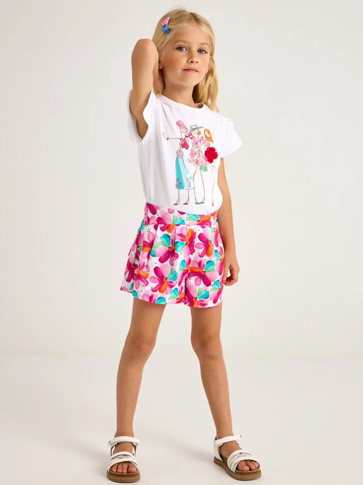 Girl modelling the Mayoral printed shorts set.