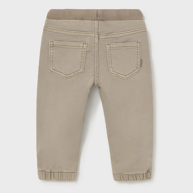 Back of the Mayoral beige pull up trousers.