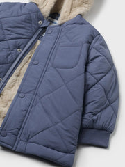 Closer view of the Mayoral quilted coat.