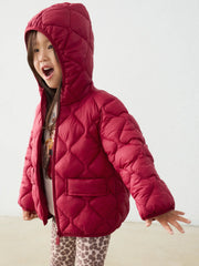 Girl in red quilted coat by Mayoral.
