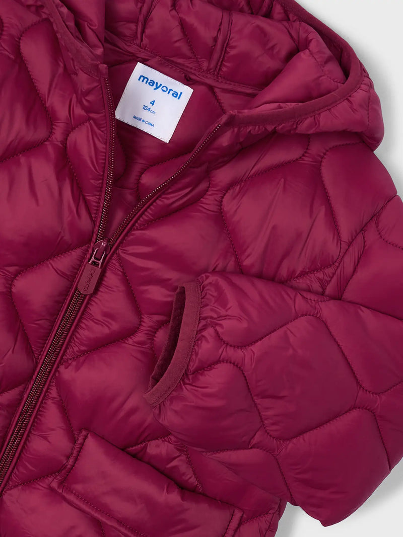 Closer look at the Mayoral quilted coat showing detail of the diamond pattern stitching.
