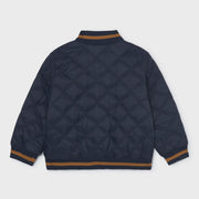 Rear view of the Mayoral navy quilted jacket.