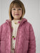 Girl wearing the Mayoral quilted jacket.