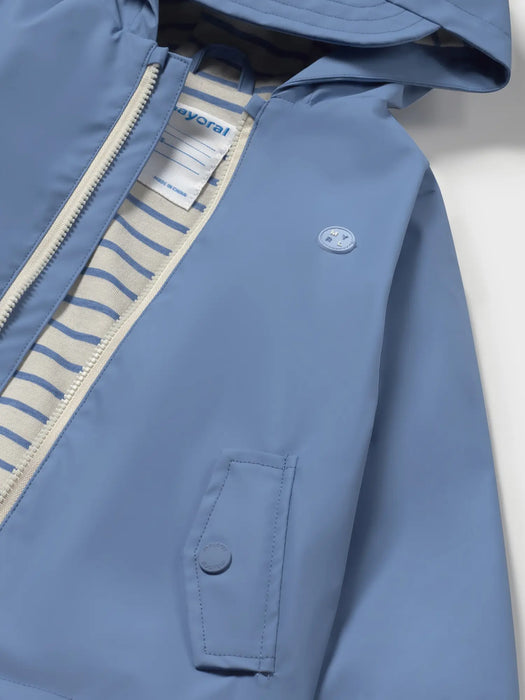 Mayoral blue raincoat with striped inner lining.