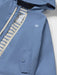 Mayoral blue raincoat with striped inner lining.