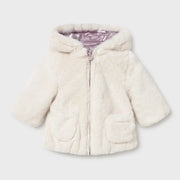 Cream faux fur side of the Mayoral girl's reversible coat.