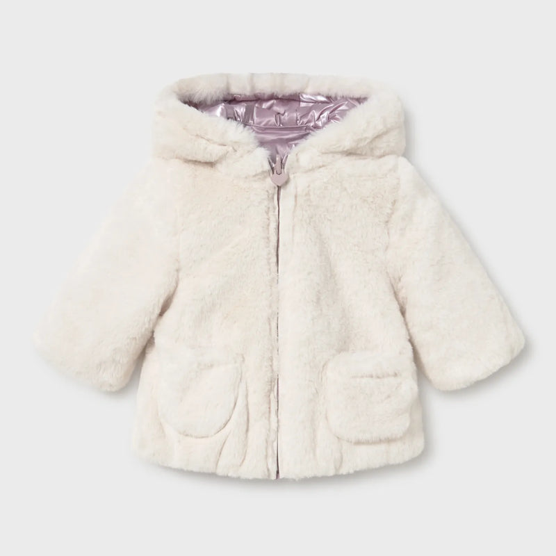 Cream faux fur side of the Mayoral girl's reversible coat.