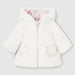 White faux fur side of the baby girl's reversible coat. 